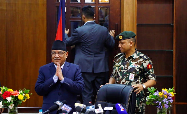 Nepalese Prime Minister Pushpa Kamal Dahal gestures before announcing his resignation in Kathmandu on Wednesday. (Reuters)