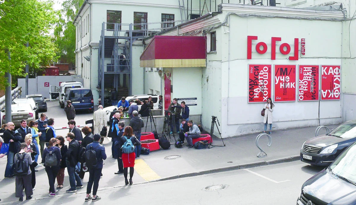 Journalists gather outside theater and film director Kirill Serebrennikov’s Gogol Center theater in Moscow on Tuesday. (AFP)
