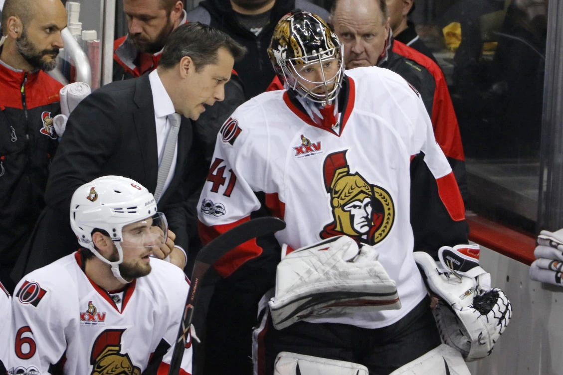 Ottawa Senators head coach Guy Boucher, left, talks with goalie Craig Anderson (41) on the bench during the first period of Game 5 of the Eastern Conference final in the NHL Stanley Cup hockey playoffs in Pittsburgh, Sunday. (AP)