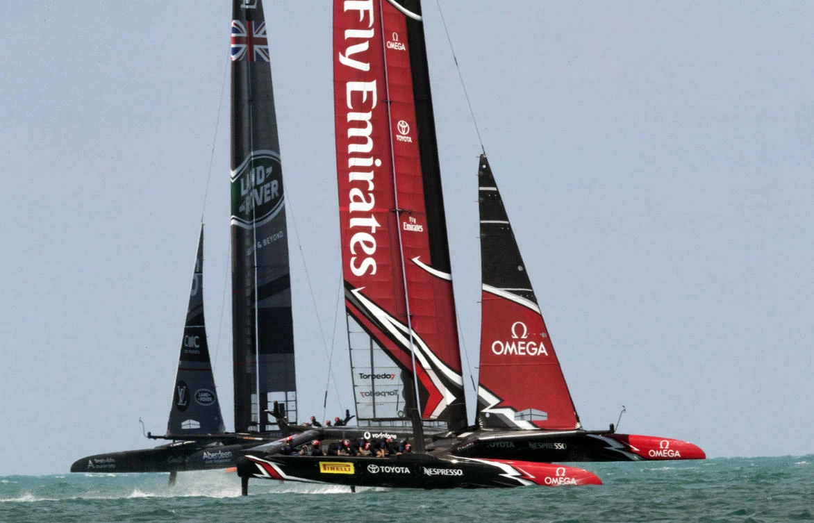 In this photo provided by the America's Cup Event Authority, Emirates Team New Zealand, right, sails alongside Land Rover BAR during a practice race on Bermuda's Great Sound before the 35th America's Cup sailing event on Tuesday. America's Cup competition begins May 26. (AP)