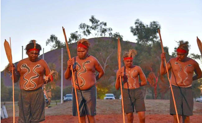 Local performers dance during the opening ceremony for the National Indigenous Constitutional Convention, a three-day conference designed to come up with a consensus response on how indigenous people should be recognized in Australia's constitution, at Mutitjulu near Uluru in central Australia, on May 23, 2017. (AAP/Lucy Hughes Jones/via Reuters)
