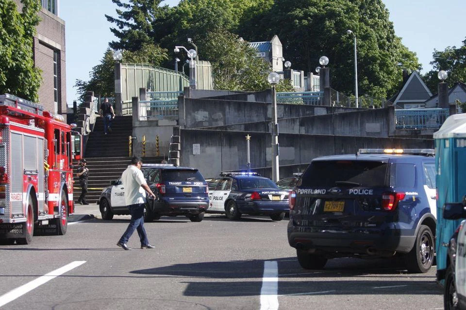 Police investigate a deadly stabbing on a Metropolitan Area Express train in northeast Portland, Ore., Friday, May 26, 2017. (AP)