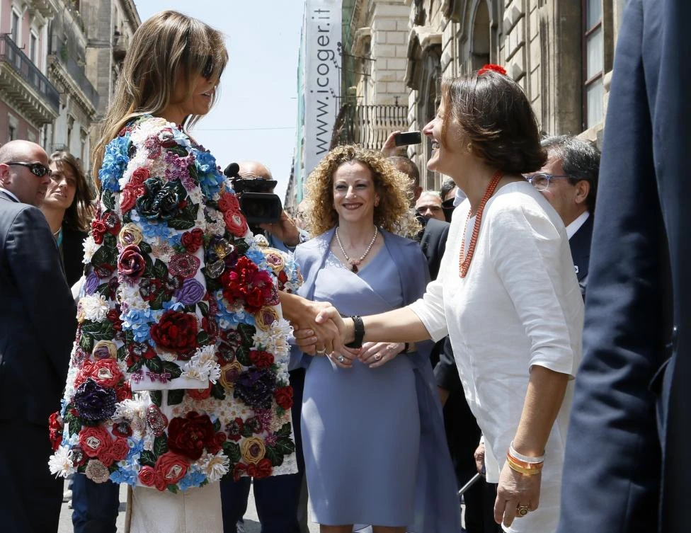 US First Lady Melania Trump, left, is welcomed by Emanuela Mauro, spouse of Italian Premier Paolo Gentiloni at Chierici Palace, part of a visit of the G7 first ladies in Catania, Italy, Friday, May 26, 2017. On Friday and Saturday, for the first time all seven are around the same table, including also newcomers Emmanuel Macron of France, Theresa May of Britain and the Italian host, Paolo Gentiloni, forging a new dynamic after a year of global political turmoil amid a rise in nationalism. (AP)