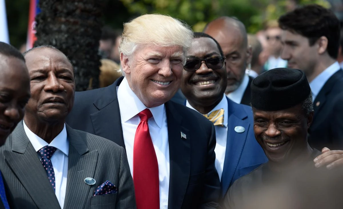 US President Donald Trump (C) shares a laugh with Guinea's President Alpha Conde (L), the Vice President of Nigeria Yemi Osinbajo (R) and other African leaders as they arrive to pose for a family photo with participants of the G7 summit during the Summit of the Heads of State and of Government of the G7, the group of most industrialized economies, plus the European Union, on May 27, 2017 in Taormina, Sicily. (AFP)