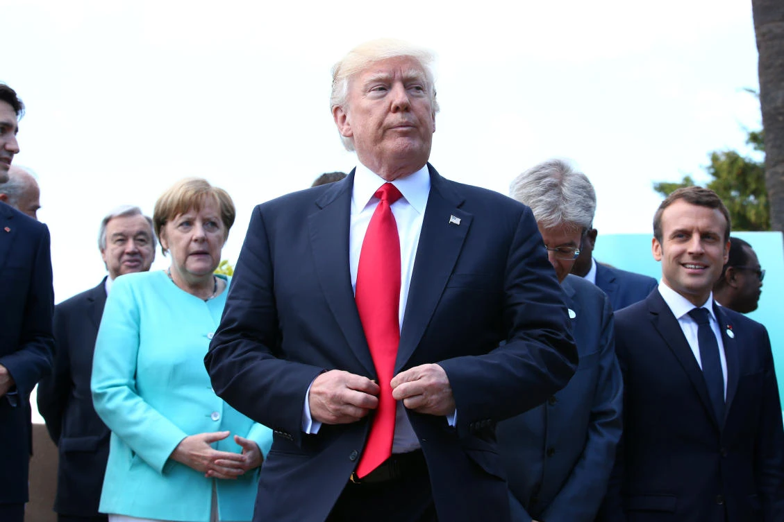 US President Donald Trump reacts after a family photo at the G7 Summit expanded session in Taormina, Sicily, Italy, on Saturday. (Reuters)