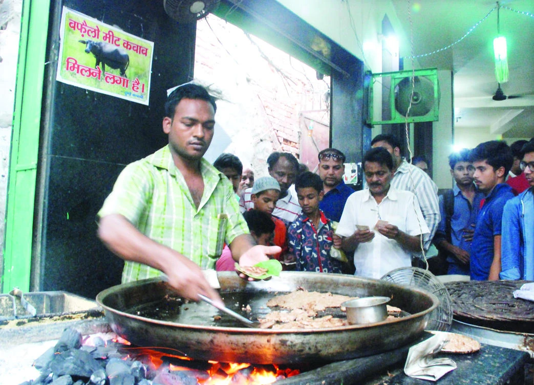 A vendor makes beef kebabs at the Tundey Kebabi Restaurant in Lucknow. (AFP)