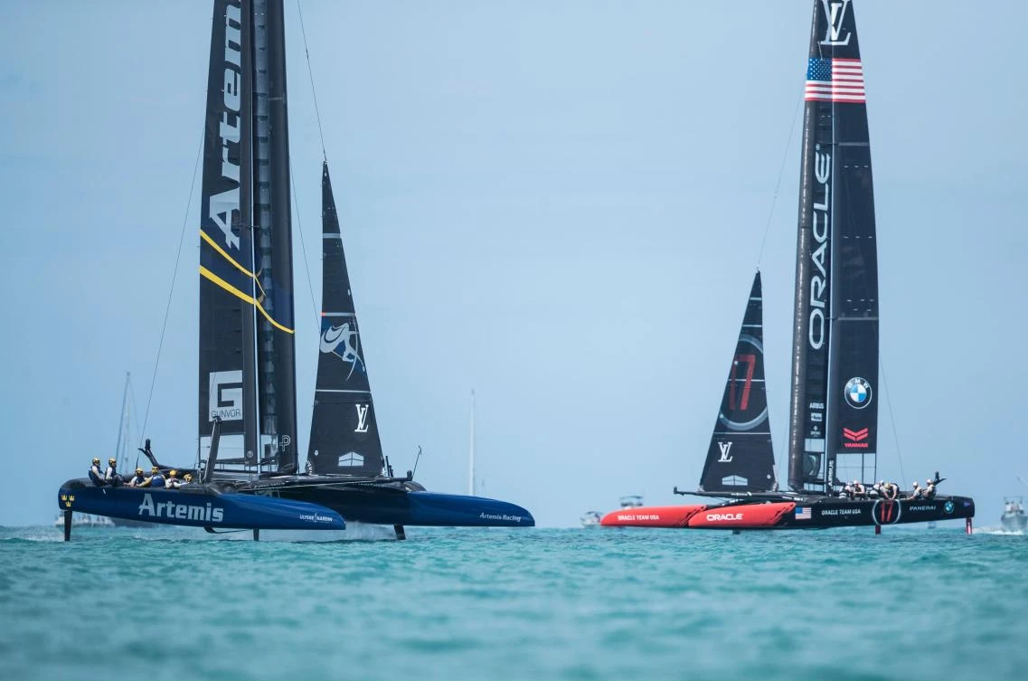 Artemis Racing, left, and Oracle Team USA compete during the second day of the America's Cup on Sunday on Bermuda's Great Sound. (AFP)