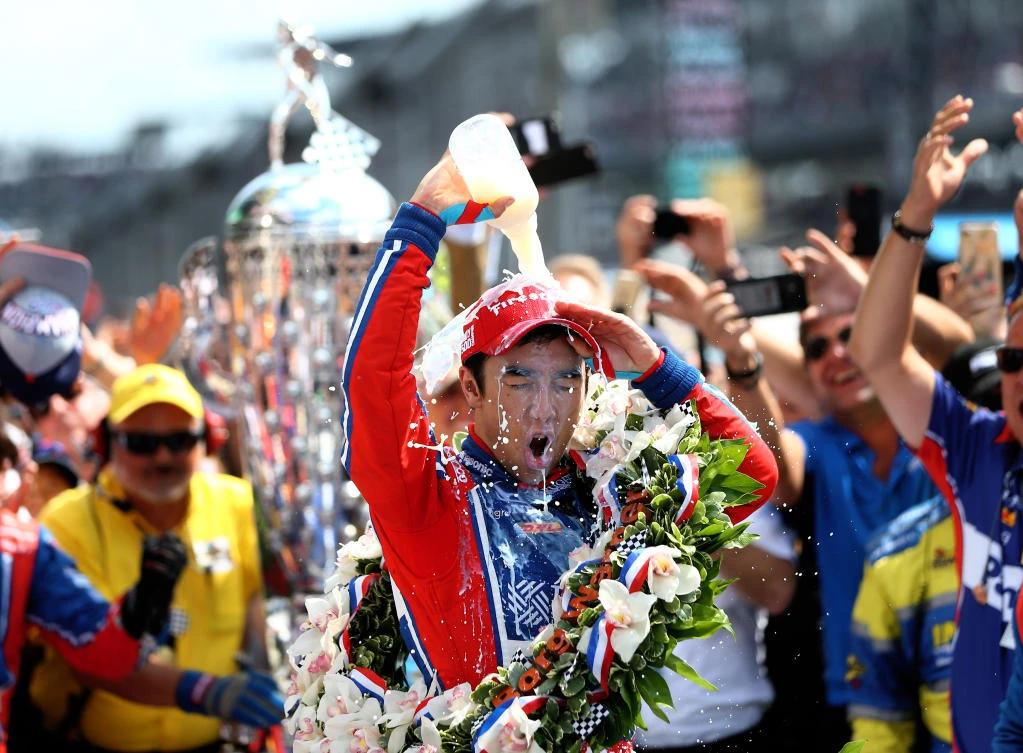 IndyCar Series driver Takuma Sato dumps milk on himself as he celebrates after winning the 101st Running of the Indianapolis 500 at Indianapolis Motor Speedway on Sunday. (USA TODAY Sports)