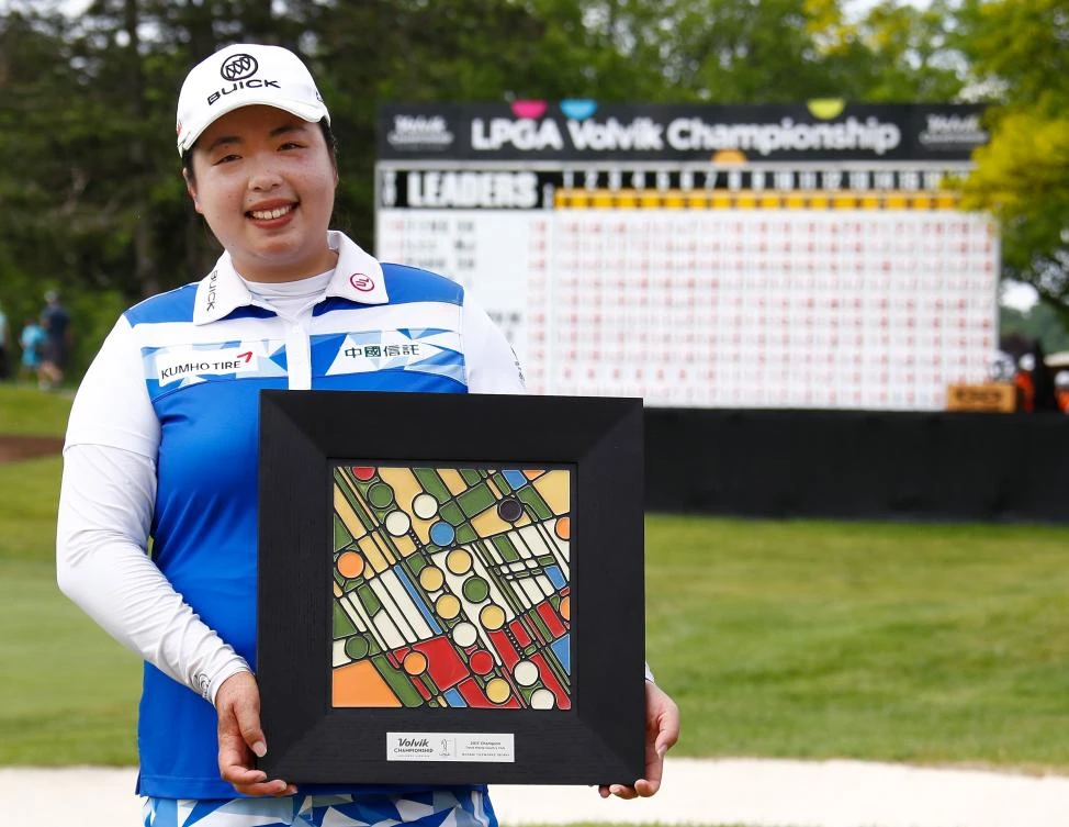 Shanshan Feng of China poses with the championship trophy after winning the LPGA Volvik Championship on Sunday at Travis Pointe Country Club Ann Arbor, Michigan. (AFP)