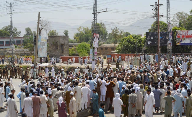 Pakistani protesters gather near a power station during a demonstration against power cuts in the Dargai area of Malakand district on Monday. (AFP)