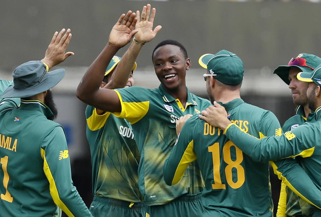 South Africa's bowler Kagiso Rabada, center, celebrates taking the wicket of England's Adil Rashid during the third One Day International cricket match between England and South Africa at Lord's cricket ground in London Monday. (AP)