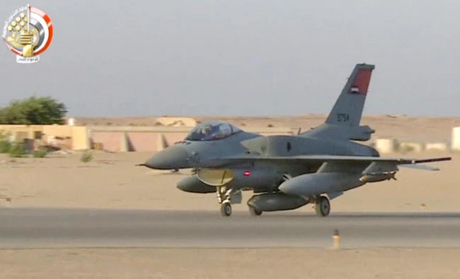 In this still image taken from video provided by the Egyptian military, a fighter jet takes off from an undisclosed location in Egypt to strike militant hideouts in the Libyan city of Darna on May 26, 2017. (Egyptian military via AP)