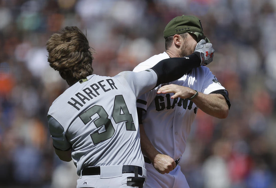 Washington Nationals' Bryce Harper (34) hits San Francisco Giants' Hunter Strickland in the face after being hit with a pitch in the eighth inning of a baseball game Monday in San Francisco. (AP)
