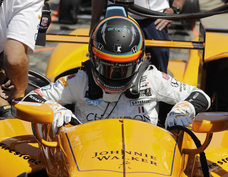 Fernando Alonso, of Spain, climbs out of his car during a practice session for the Indianapolis 500 IndyCar auto race at Indianapolis Motor Speedway, Monday in Indianapolis. (AP)