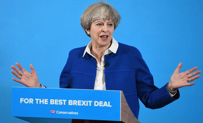 Britain's Prime Minister, and Leader of the Conservative party, Theresa May delivers a general election campaign speech in Wolverhampton, central England, on Tuesday, as campaigning continues in the build up to the general election on June 8. (AFP)