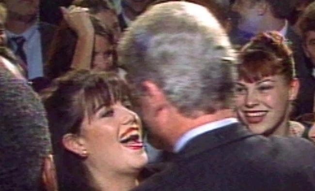 In this October 1996 Reuters photo, US President Bill Clinton greets Monica Lewinsky (L) at a Washington fundraising event. Philippine President Rodrigo Duterte on Wednesday resurrected Clinton's scandalous affair with the former White House intern after Clinton's daughter Chelsea denounced him on Twitter as a "murderous thug." (REUTERS/File)