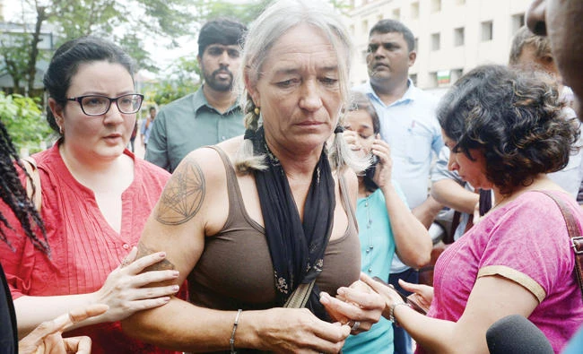 Fiona MacKeown, center, the mother of murdered British schoolgirl Scarlett Keeling, leaves a court in Panaji, India, in this file photo. (AFP)
