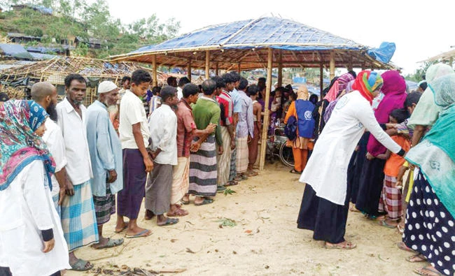A medical team provides treatment to migrants at a refugee camp in Cox’s Bazar, Bangladesh. (AFP)