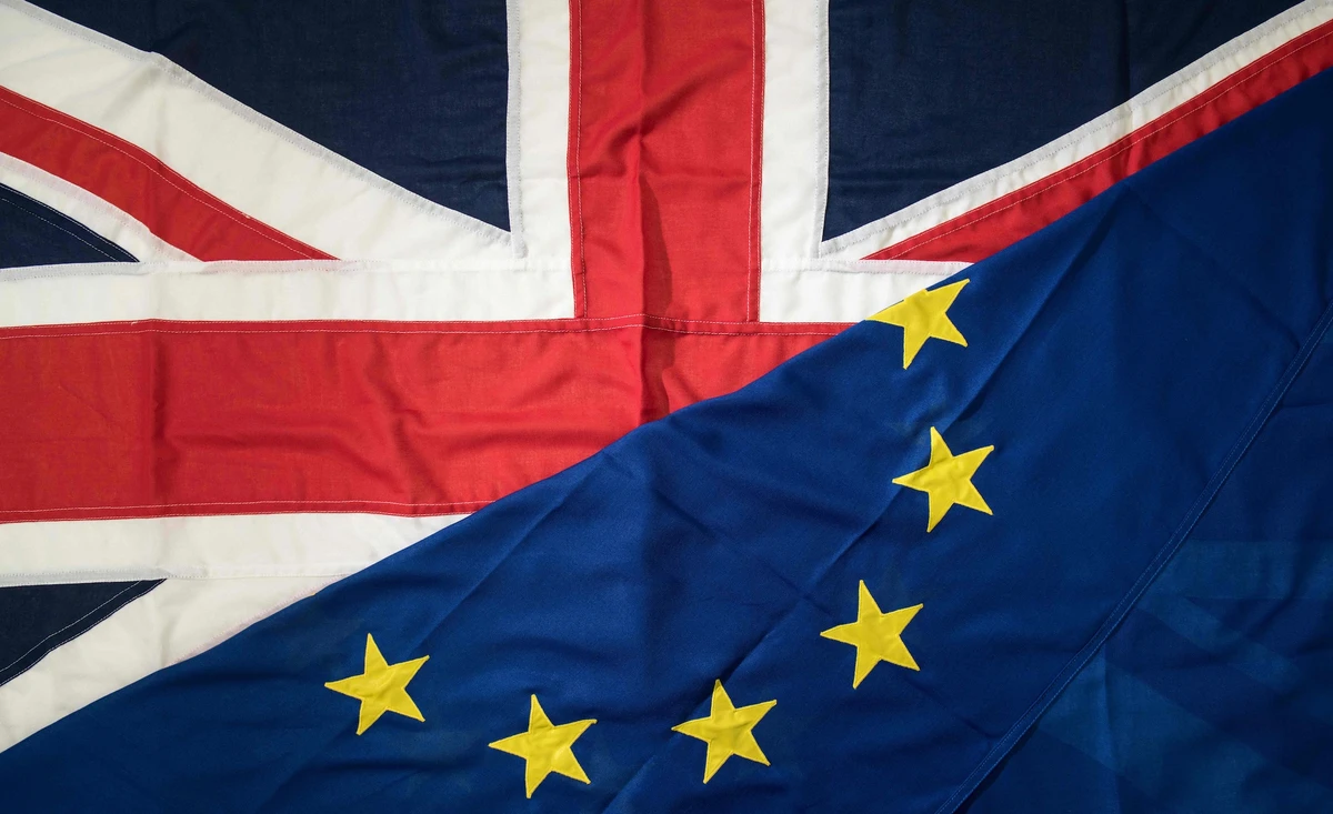 This file photo taken on March 24, 2017 shows a picture shows flags arranged as an illustration, a Union Flag (L) and a European Union (EU) flag (R) at the factory of 'Flagmakers' in Chesterfield, northern England on March 24, 2017. EU migrants said on June 23 that far from being "generous", Prime Minister Theresa May's offer for their post-Brexit residency was niggardly and left them prey to the whims of British lawmakers. One year ago today on June 23, 2016 Britain voted to leave the European Union. (AFP)