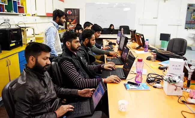 In this photo taken on February 6, 2017, employees of Indian company Nuts and Boltz work in their office in New Delhi. (AFP)