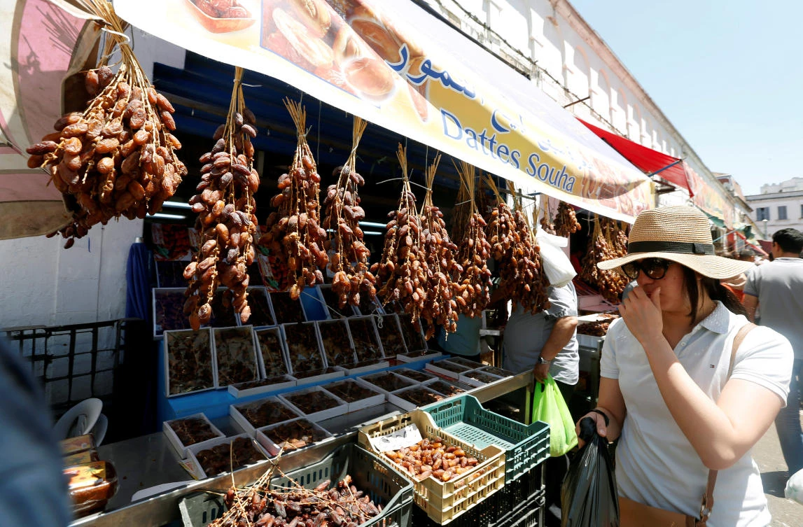 A woman looks at dates market in Ramadan in Tunis, Tunisia. (Reuters)