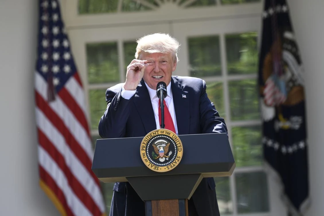 US President Donald Trump announces his decision to withdraw the US from the Paris Climate Accords in the Rose Garden of the White House in Washington, DC. (AFP)