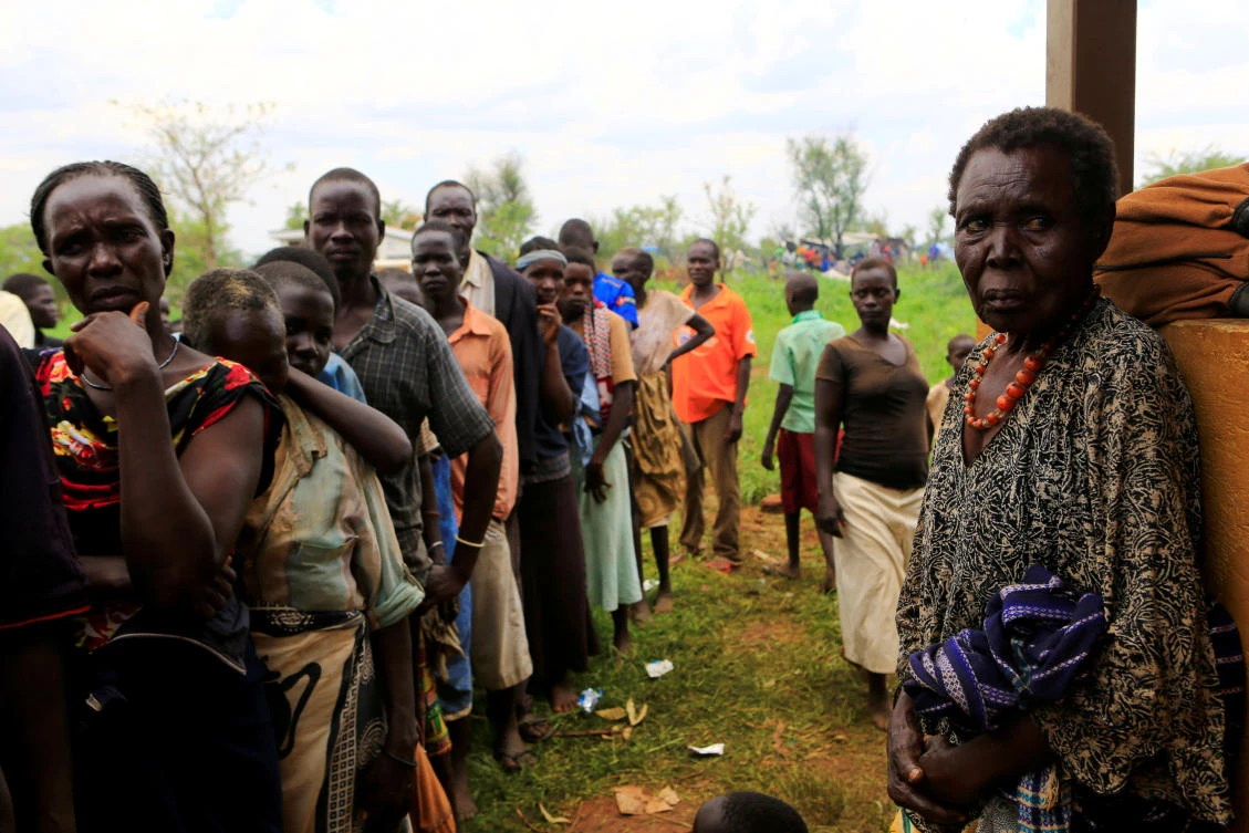 South Sudanese families displaced by fighting queue for vaccination in Lamwo after fleeing fighting in Pajok town across the border in northern Uganda. (REUTERS)