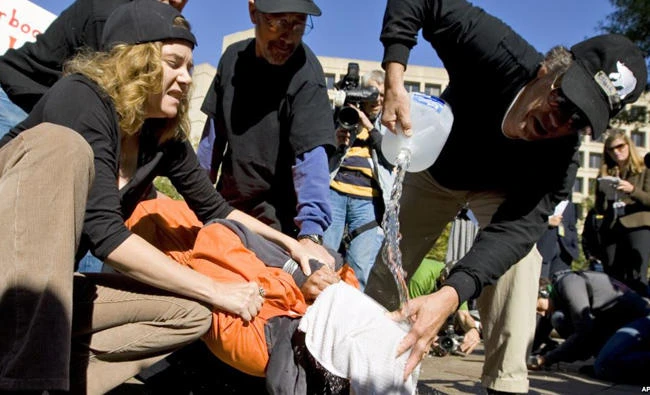Protesters demonstrate the use of waterboarding in front of the Department of Justice in Washington, D.C. (AP file photo)