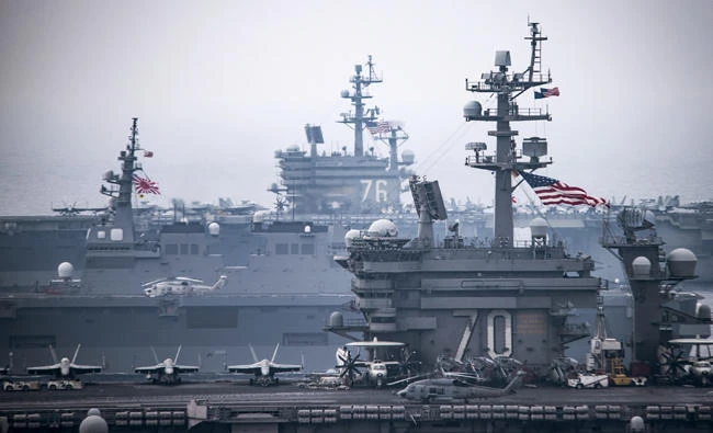 In this image taken June 1, 2017, and released by the US Navy, USS Carl Vinson (CVN 70) and USS Ronald Reagan (CVN 76) operate in the Sea of Japan during a US-Japan joint training. (US Navy via AP)