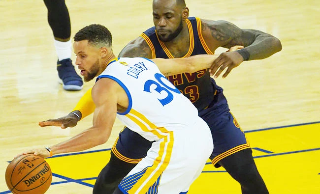 Golden State Warriors guard Stephen Curry (30) battles for the ball with Cleveland Cavaliers forward LeBron James (23) in the first half of the NBA Finals at Oracle Arena. (USA TODAY Sports)