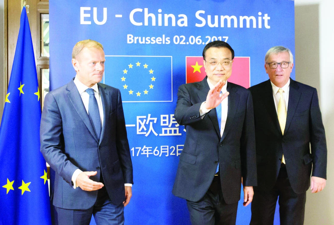 From left: European Council President Donald Tusk, Chinese Premier Li Keqiang and EU Commission President Jean-Claude Juncker pose during a EU-China Summit in Brussels, Belgium, on Friday. (Reuters)