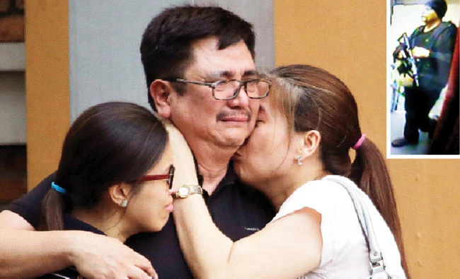 A man is comforted by his family as they await the body of their loved one at the Resorts World Manila complex. Inset: The suspected gunman in a CCTV picture. (Reuters, AP)