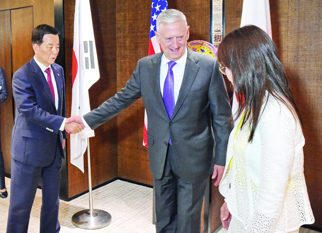 US Defense Secretary Jim Mattis with South Korea’s Defense Minister Han Min-Koo and Japan’s Defense Minister Tomomi Inada in Singapore on Saturday. (AFP)