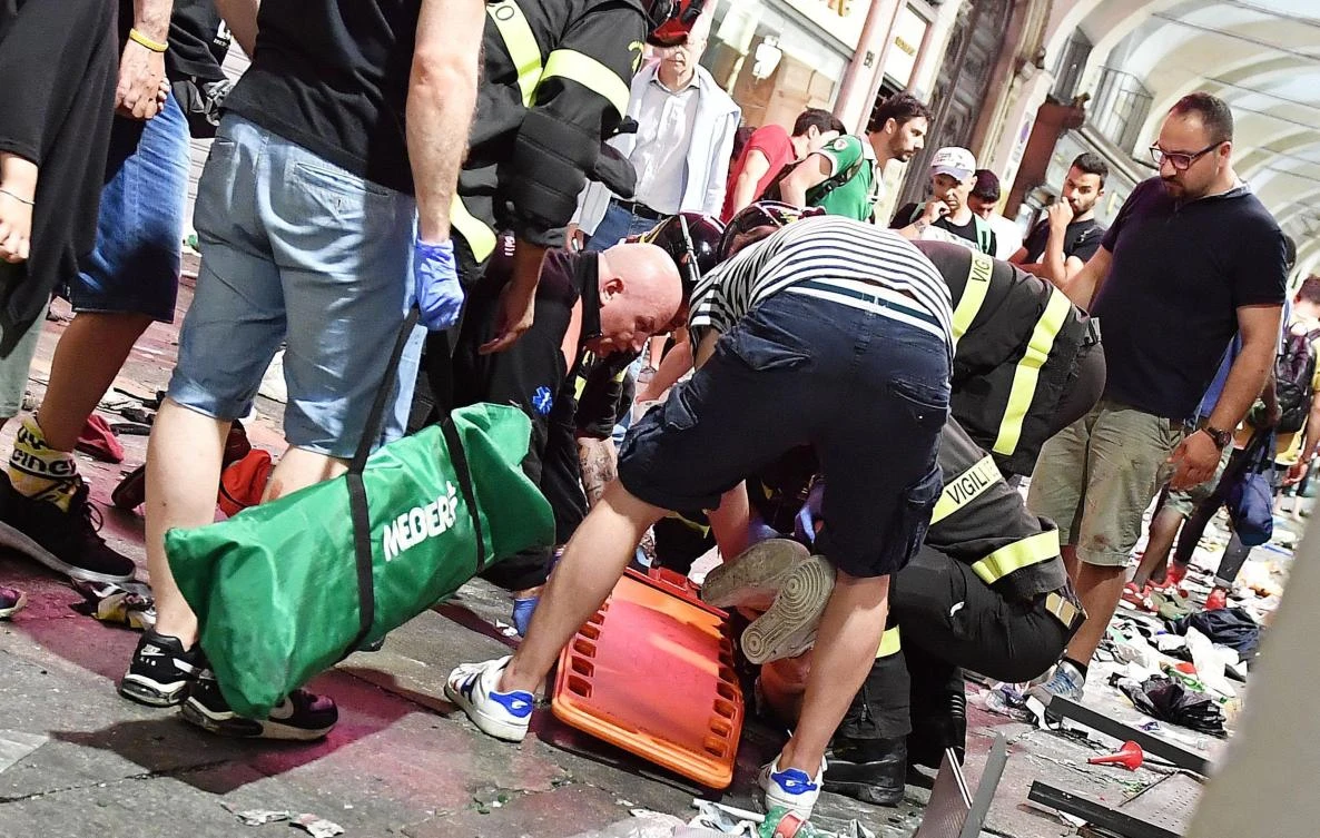An injured Juventus fan is placed on a stretcher by Italian firefighters in San Carlo’s square at the end of the Champions League final soccer match between Juventus and Real Madrid, in Turin, Italy, Saturday, June 3, 2017. (Photo: Alessandro Di Marco/ANSA via AP)