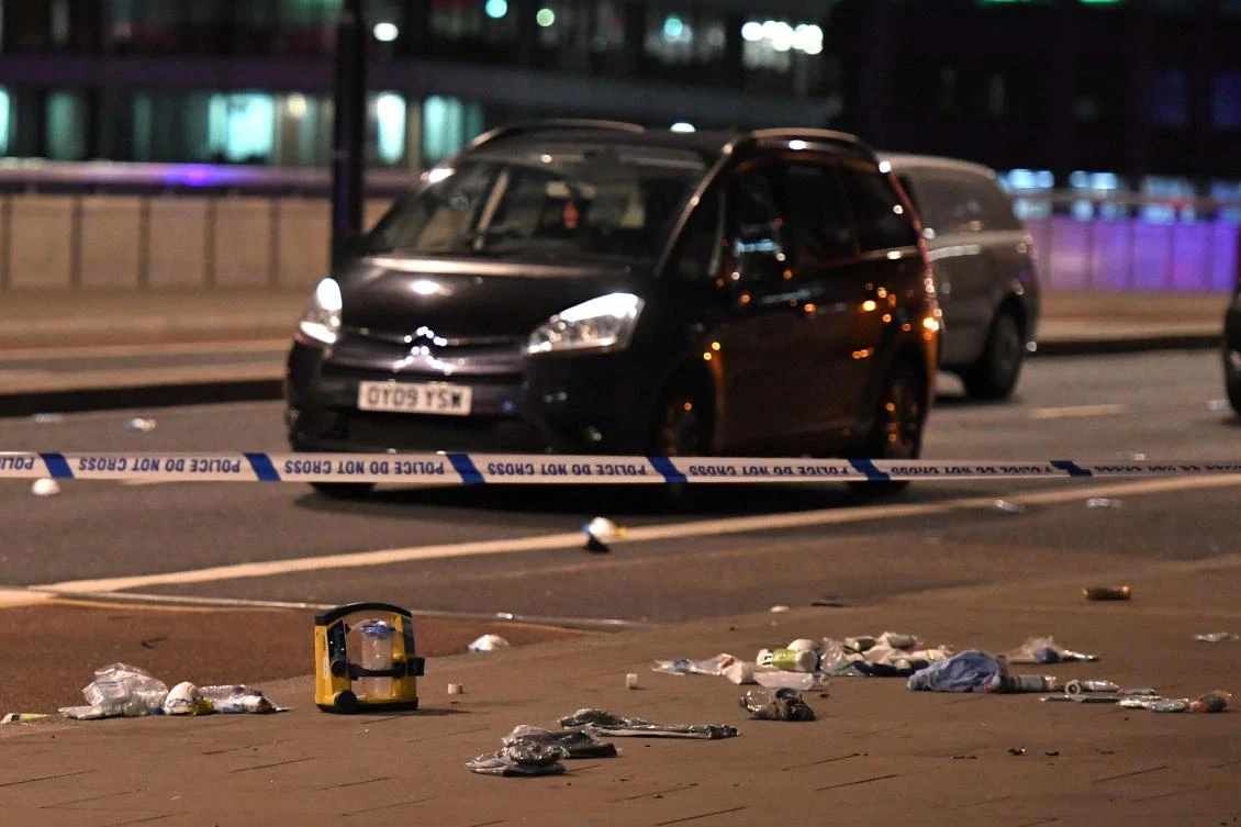 Debris and abandoned cars remain on London at the scene of an apparent terror attack in central London on June 3, 2017. Armed police fired shots after reports of stabbings and a van hitting pedestrians on London Bridge on Saturday in an incident reminiscent of a terror attack in March just days ahead of a general election. (AFP)