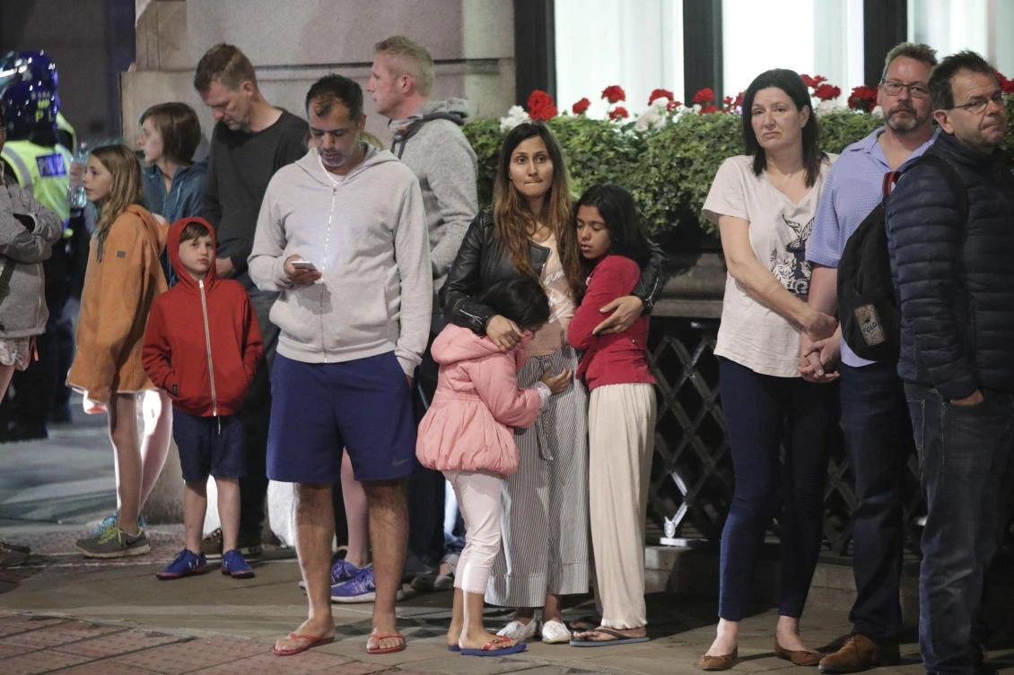 Guests from the Premier Inn Bankside Hotel are evacuated and kept in a group with police on Upper Thames Street following an incident in central London, Saturday, June 3, 2017. Terrorism struck at the heart of London, police said Sunday, after a vehicle veered off the road and mowed down pedestrians on London Bridge and gunshots rang out amid reports of knife attacks at nearby Borough Market. (AP)