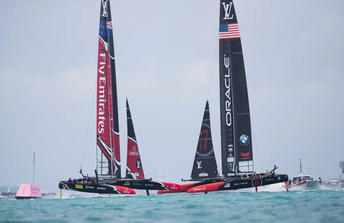 Emirates Team New Zealand, left, skippered by Peter Burling, competes against Oracle Team USA, right, skippered by Jimmy Spithill, in the America's Cup on Saturday on Bermuda's Great Sound. Holders Oracle Team USA defeated Emirates Team New Zealand to win the round-robin phase of qualifying for the 35th America's Cup. (AFP)