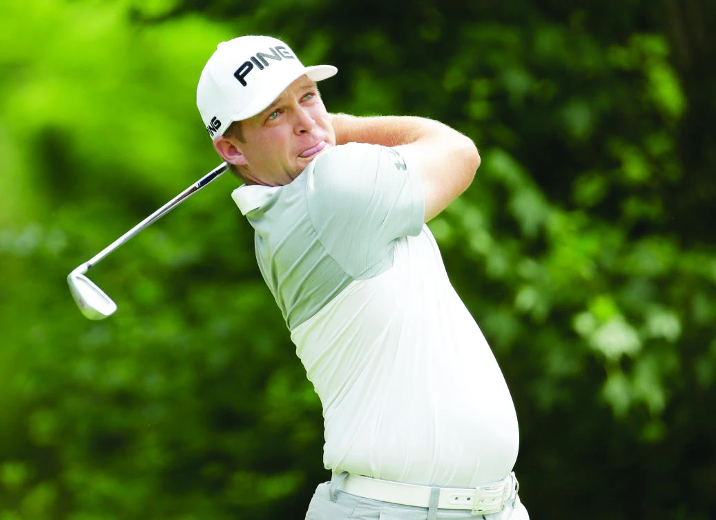 Daniel Summerhays watches his tee shot on the 18th hole during the third round of the Memorial Tournament at Muirfield Village Golf Club on Saturday in Dublin, Ohio. (AFP)