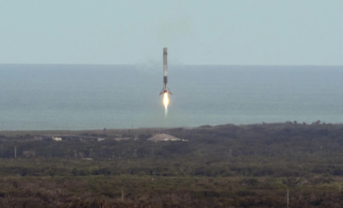 The SpaceX Falcon 9 first stage booster rocket lands. (Bill Ingalls/NASA via AP)