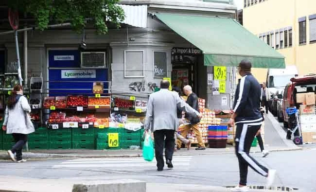 People walk past a local shop at the Gronland district in Oslo, Norway, in this June 3, 2017 photo. (REUTERS)