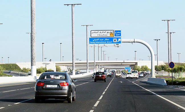 Cars drive on a road leading to Hamad International Airport in Doha, Qatar on Monday. (REUTERS)