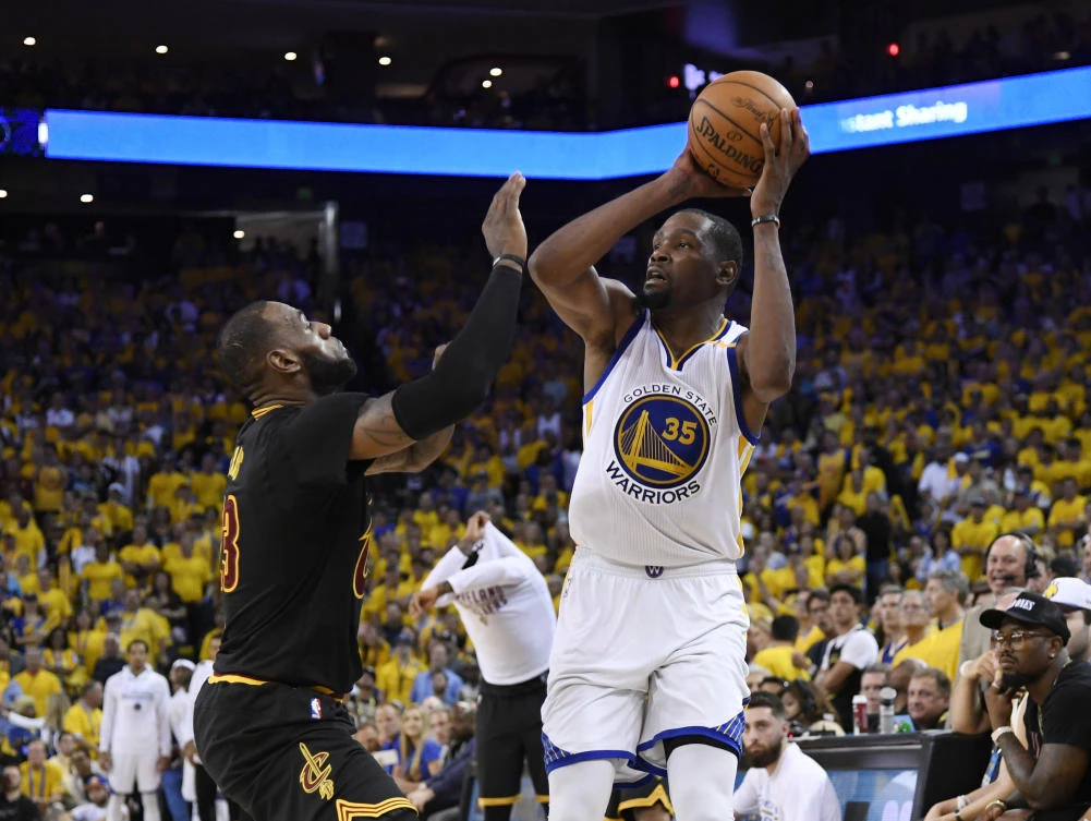 Golden State Warriors forward Kevin Durant shoots over Cleveland Cavaliers forward LeBron James during the second half in Game 2 of the 2017 NBA Finals at Oracle Arena on Sunday. (USA TODAY Sports)