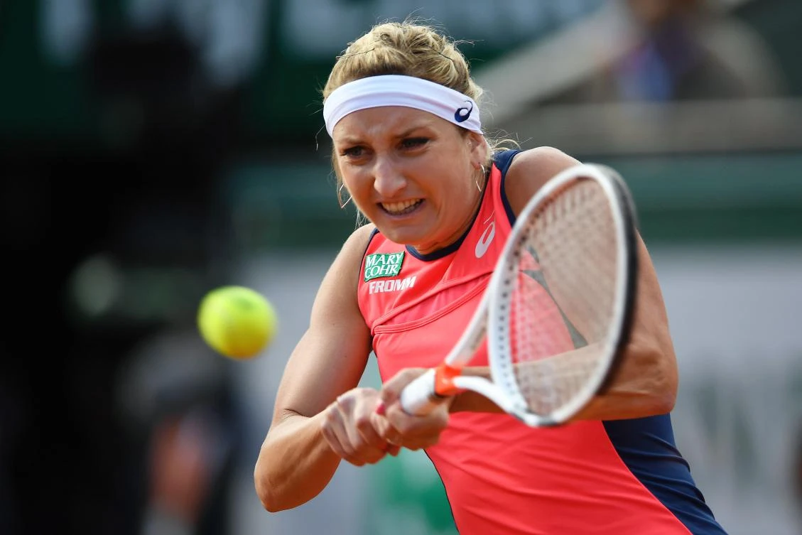 Switzerland's Timea Bacsinszky returns the ball to France's Kristina Mladenovic during their match in the 2017 French at Open Roland Garros on Tuesday in Paris. (AFP)