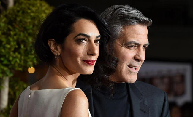 File photo dated February 1, 2016 shows actor George Clooney and wife Amal at the Regency Village Theater, in Westwood, California. (AFP / Valerie Macon)