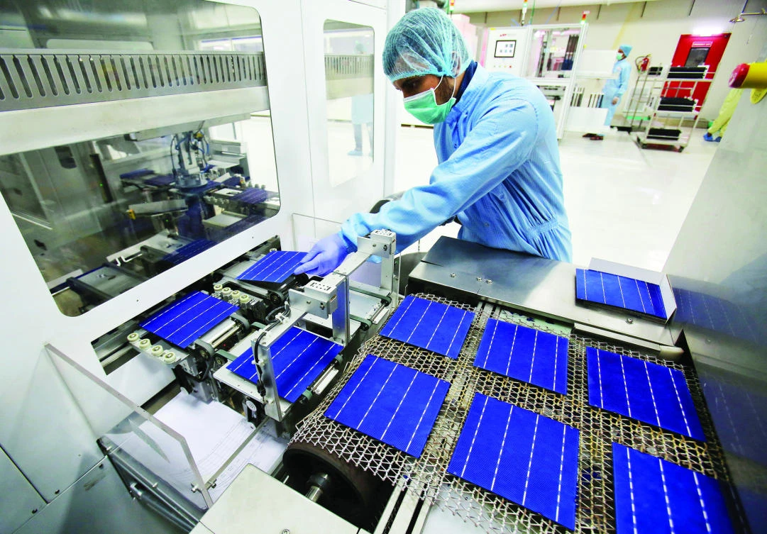 An employee works at a solar cell production line at Jupiter Solar Power Ltd. (JSPL) plant in Baddi, in the northern state of Himachal Pradesh, India in this file photo. (Reuters)