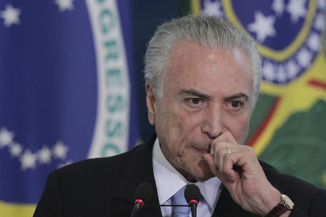 Brazil's President Michel Temer attends the inauguration ceremony of the new Minister of Justice Torquato Jardim, at the Planalto presidential palace, in Brasilia, Brazil, Wednesday, May 31, 2017. (AP Photo/Eraldo Peres)