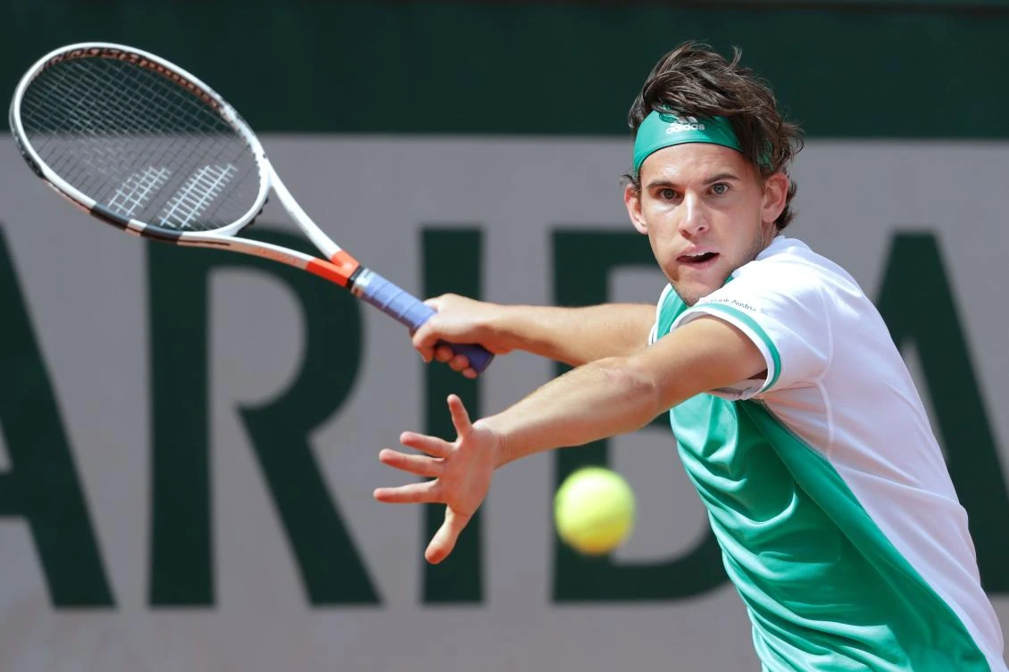 Austria's Dominic Thiem returns the ball to Serbia's Novak Djokovic during their tennis match at the Roland Garros 2017 French Open on Wednesday in Paris. (AFP)