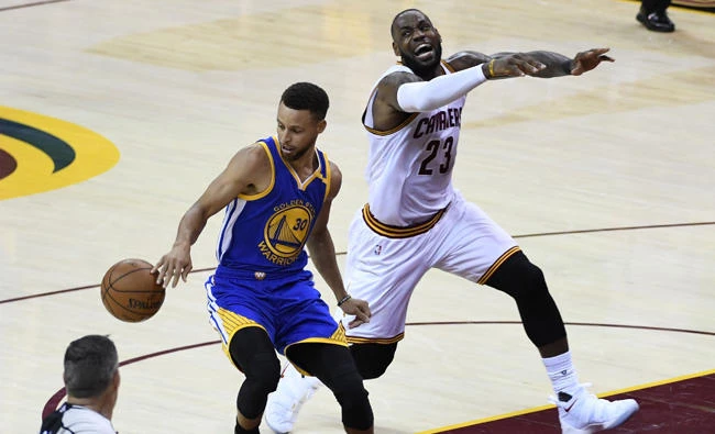 Golden State Warriors guard Stephen Curry (30) steals the ball from Cleveland Cavaliers forward LeBron James (23) during the second quarter in game three of the 2017 NBA Finals at Quicken Loans Arena. (Kyle Terada-USA TODAY Sports)