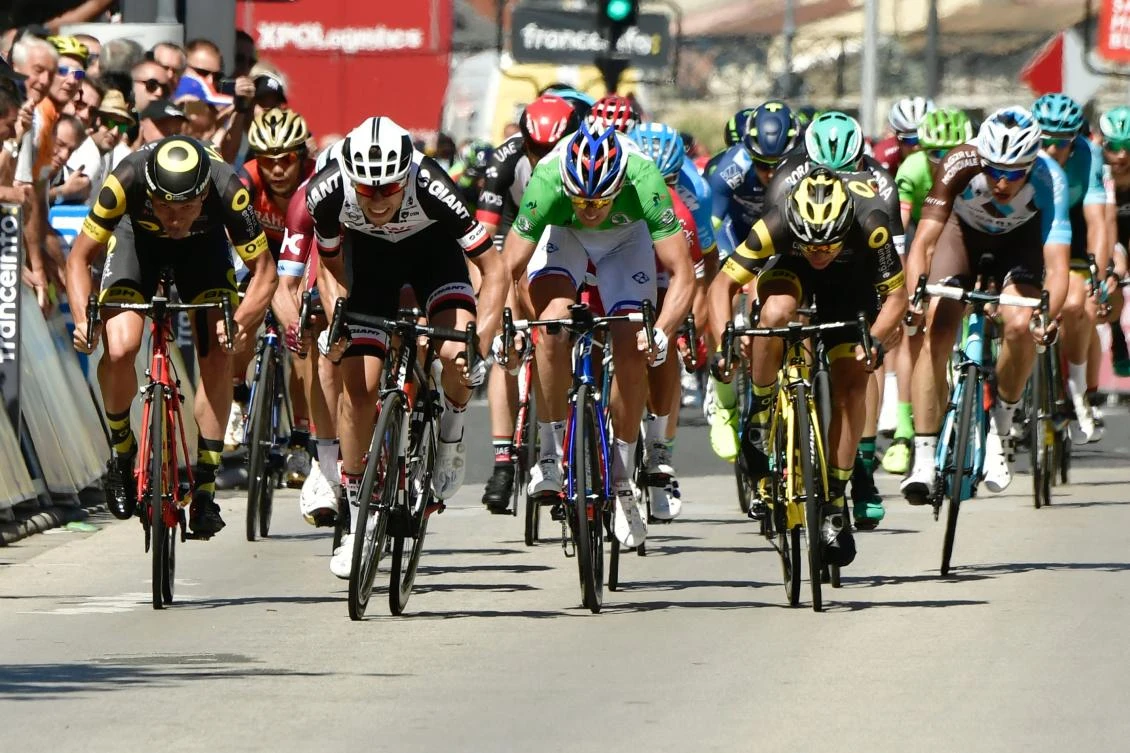 Germany's Phil Bauhaus, second left, sprints to win ahead of France's Arnaud Demare, center, wearing the best sprinter's green jersey, at the end of the 175.5 km fifth stage of the 69th edition of the Criterium du Dauphine cycling race on Thursday between La Tour-de-Salvagny and Macon. (AFP)