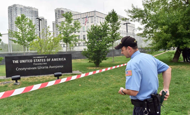 A security officer stand guards the US embassy in Kiev on Thursday. (AFP)